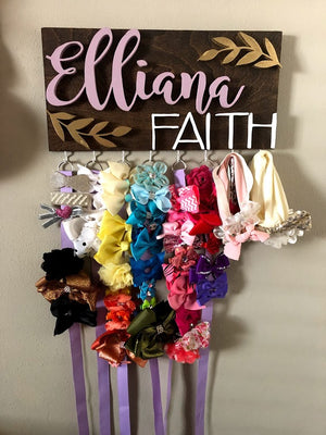 "Custom 16x8 Bow Holder with 8 Hooks, 8 Ribbons, and Adorable Leaf Design - Perfect Mom or Baby Shower Gift! Personalized with a Girl's Name for a Charming Addition to Any Nursery or Room Decor." Woodwork Barn